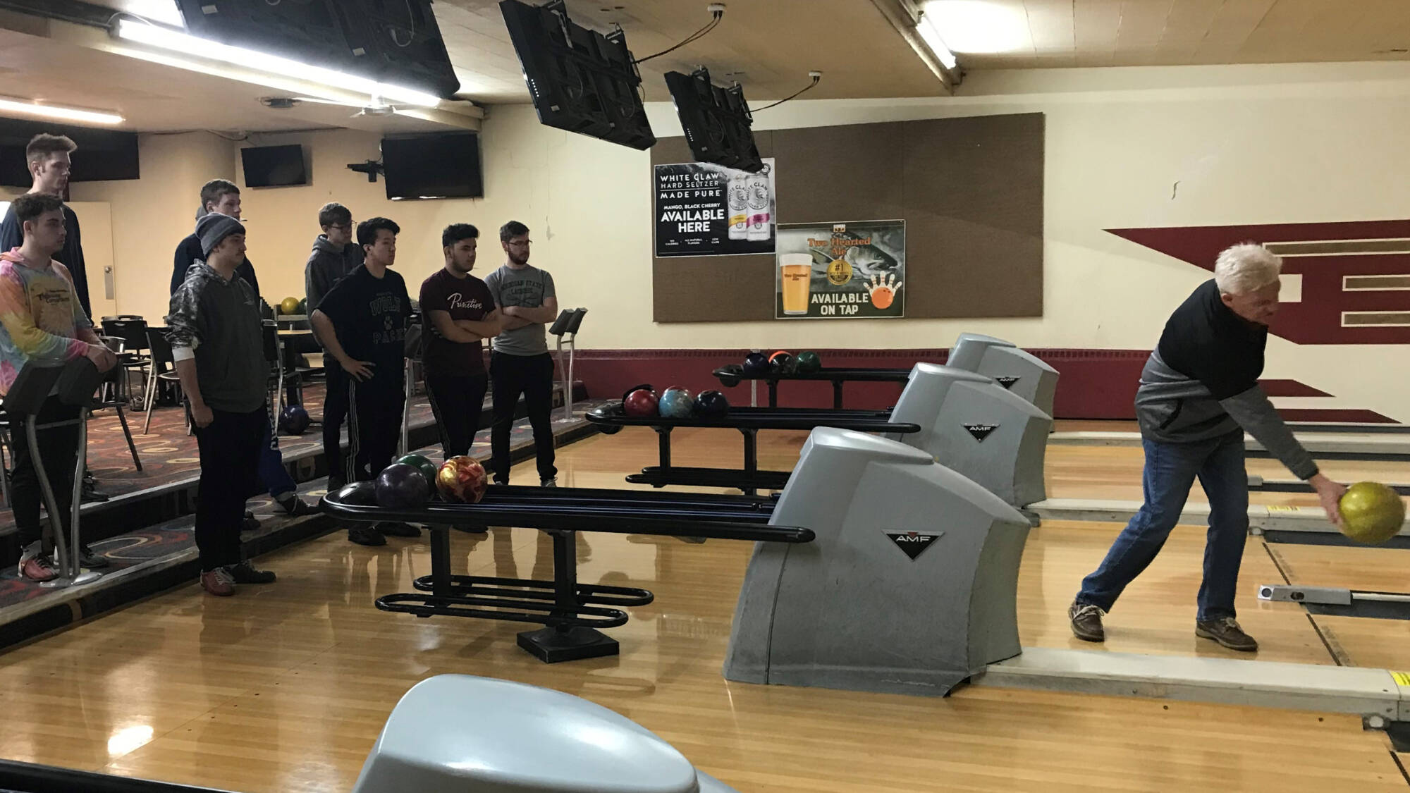 instructor demonstrating bowling